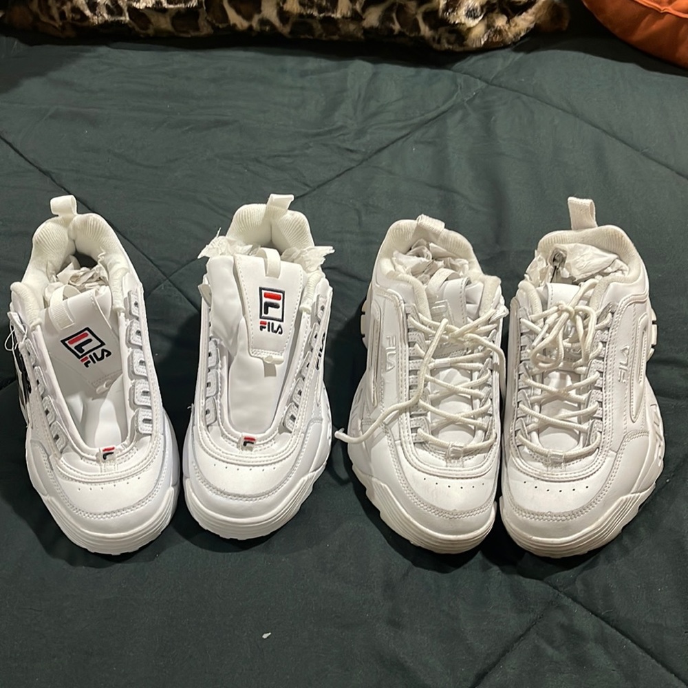 Two pair of Fila tennis shoes.